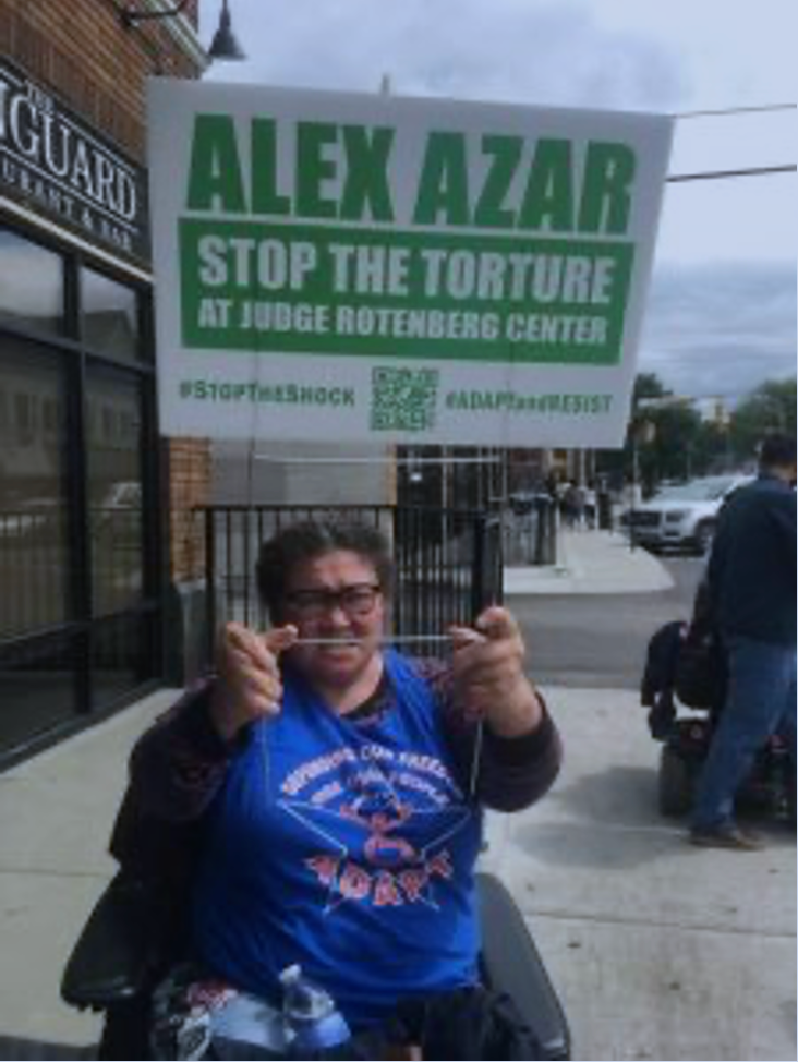 ADAPT activist protesting the Judge Rotenberg Center. Photo courtesy of adapt.org.
