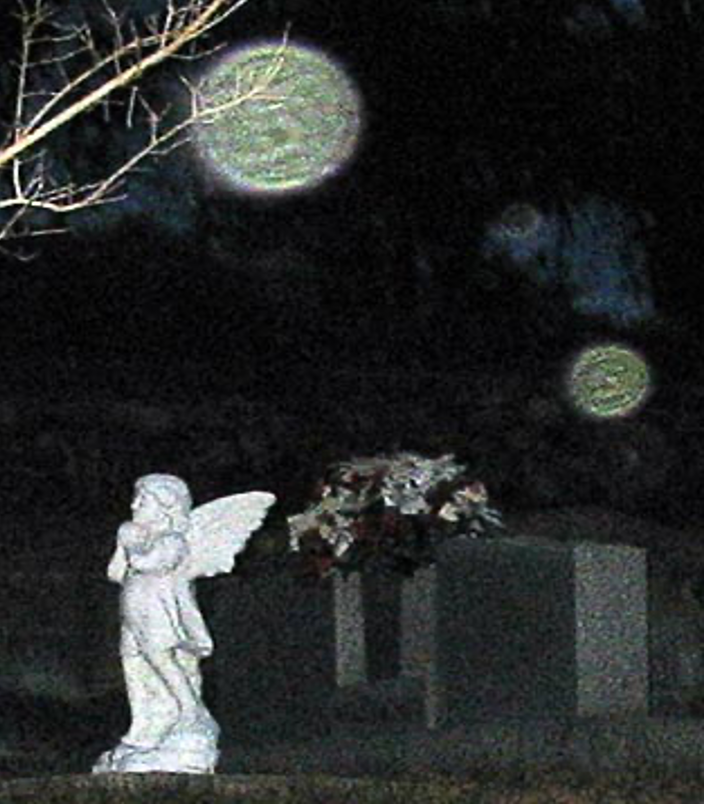 Copyright Al & Patt Harris. Three orbs are visible from this different vantage point. Photo was enlarged and cropped but no enhancements were added.